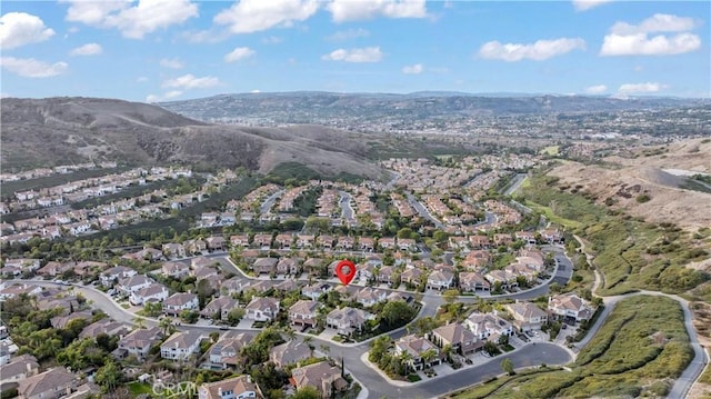 drone / aerial view with a residential view and a mountain view