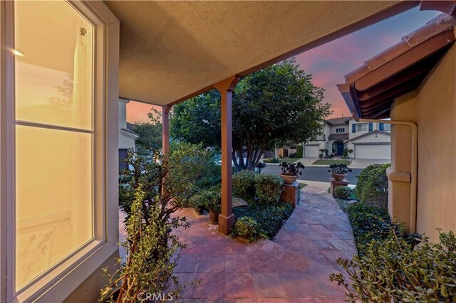 view of patio terrace at dusk