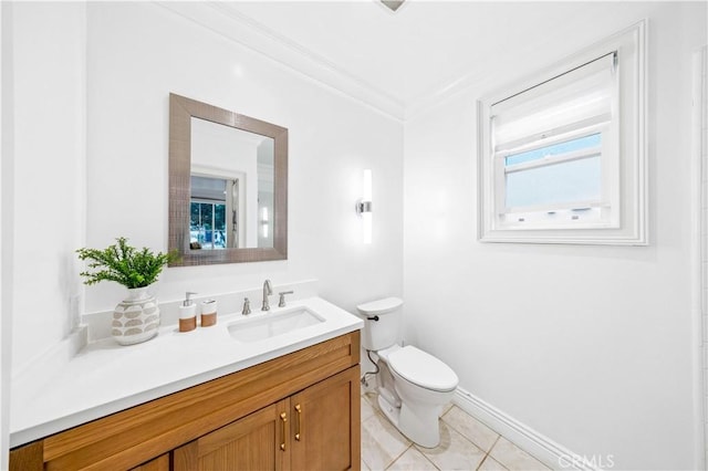 half bath featuring toilet, ornamental molding, vanity, baseboards, and tile patterned floors