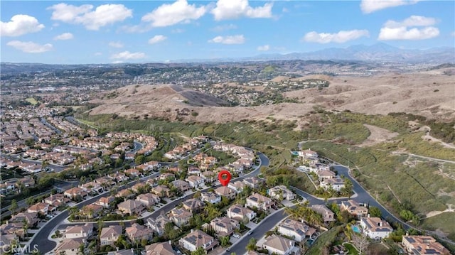 bird's eye view featuring a residential view and a mountain view