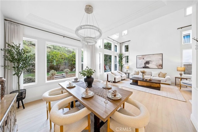 sunroom / solarium with a chandelier and a healthy amount of sunlight