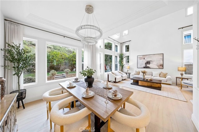 sunroom / solarium with a chandelier