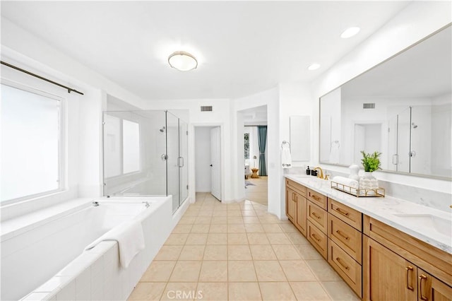 bathroom featuring double vanity, visible vents, tile patterned flooring, a shower stall, and a bath