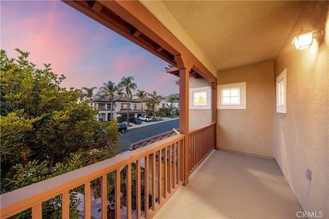 balcony at dusk with a residential view