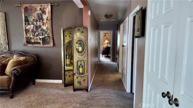 hallway featuring carpet