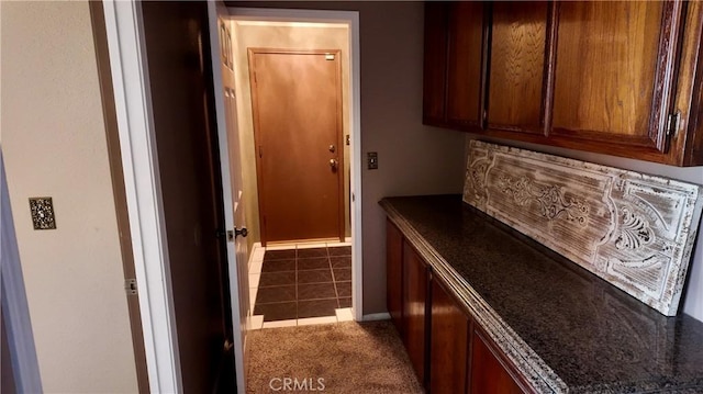 bar featuring dark colored carpet