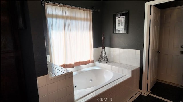 bathroom featuring tiled bath and tile patterned floors