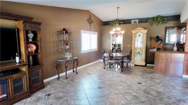 dining space with lofted ceiling and a notable chandelier