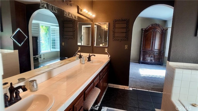 bathroom with tile patterned flooring and vanity