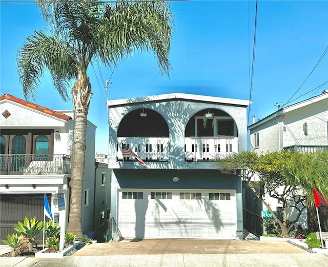 view of front of home featuring a garage and a balcony