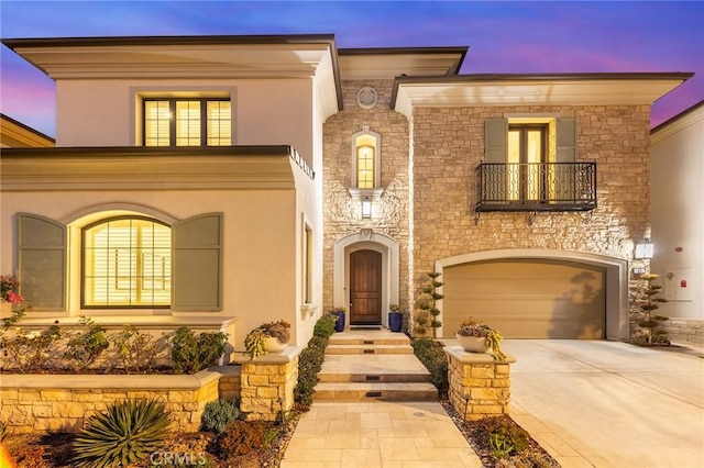 view of front of house with a balcony and a garage