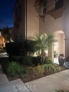 property exterior at night with stucco siding