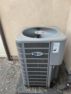 exterior details featuring central air condition unit and stucco siding