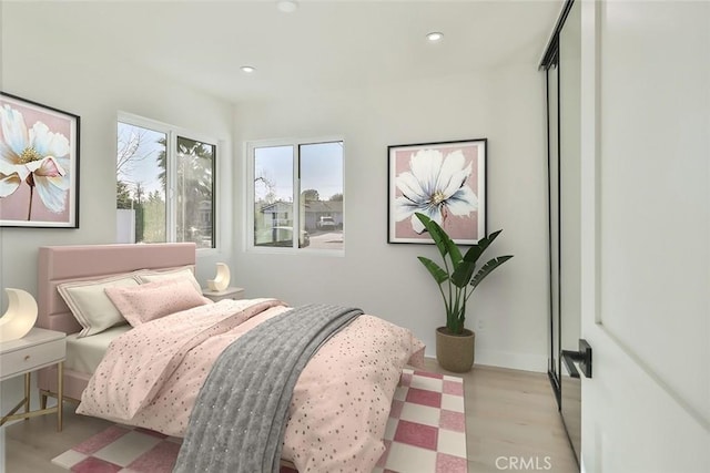 bedroom featuring light hardwood / wood-style floors