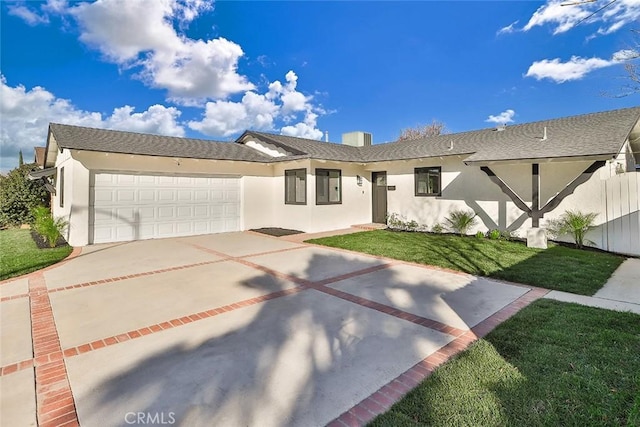 view of front of home featuring a garage and a front yard