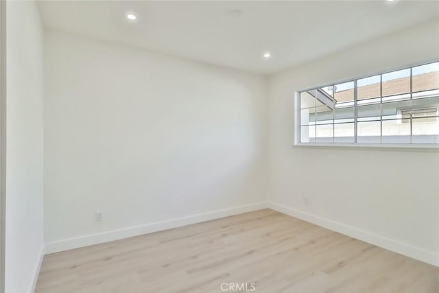 unfurnished room featuring light hardwood / wood-style flooring