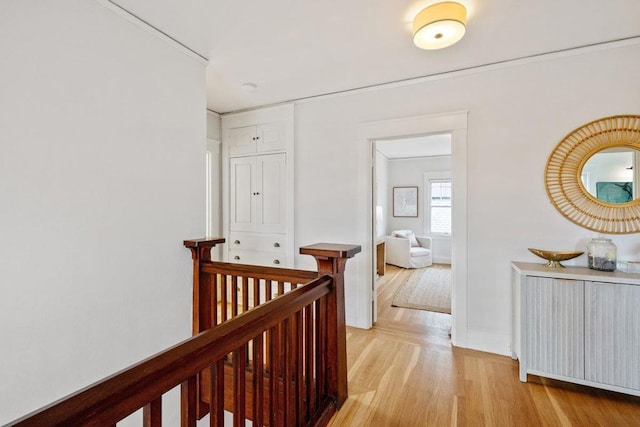 corridor with light hardwood / wood-style floors