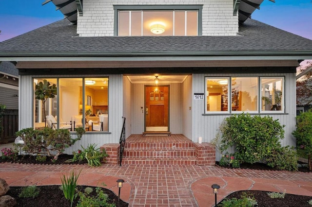 view of exterior entry at dusk