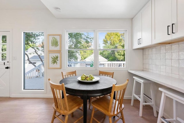 dining space featuring light hardwood / wood-style floors