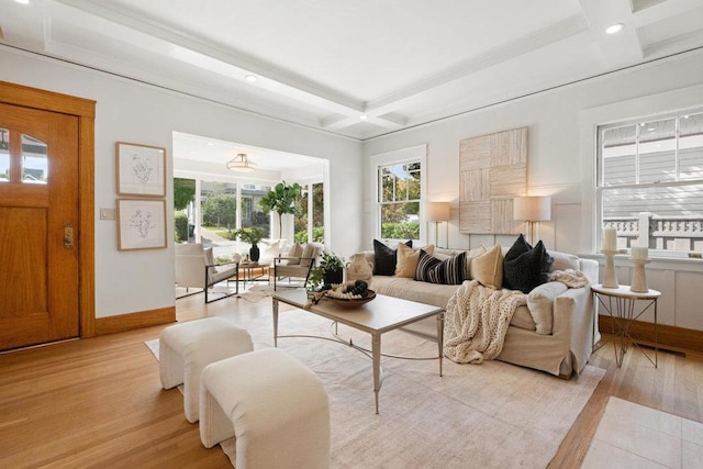 living room featuring beamed ceiling, coffered ceiling, and light wood-type flooring