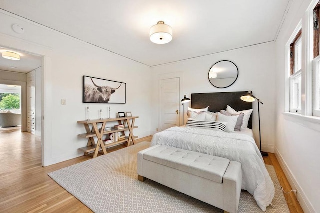 bedroom with light hardwood / wood-style flooring