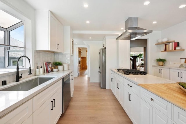 kitchen featuring white cabinetry, appliances with stainless steel finishes, and island range hood