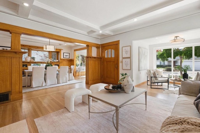 living room featuring beamed ceiling, coffered ceiling, and light hardwood / wood-style floors