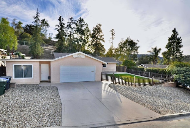 ranch-style house with a garage and a front yard