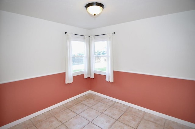 unfurnished room with light tile patterned floors