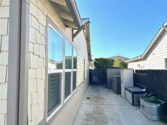 view of side of property with a patio