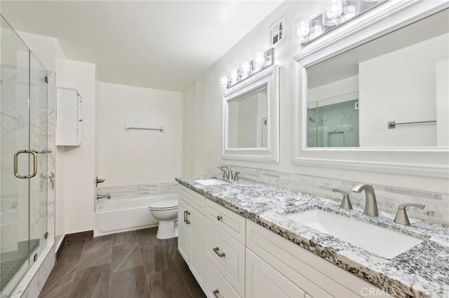 full bathroom with vanity, toilet, and separate shower and tub