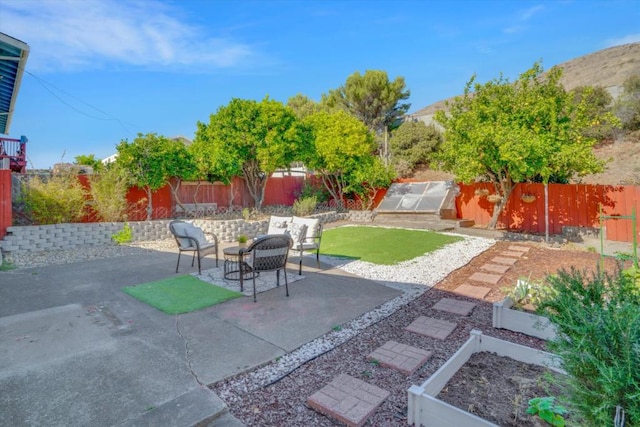 view of patio / terrace featuring a mountain view