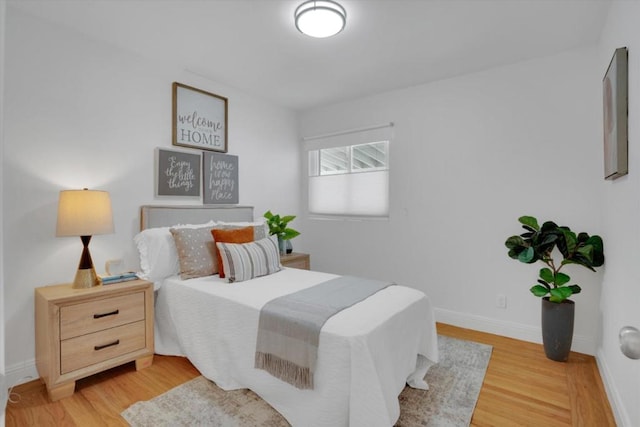 bedroom with light hardwood / wood-style flooring