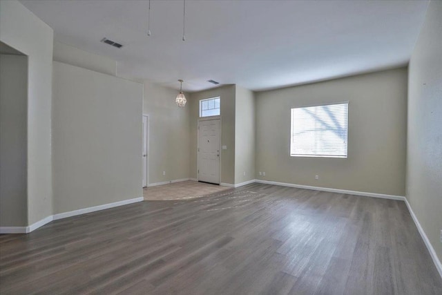 empty room with dark hardwood / wood-style floors