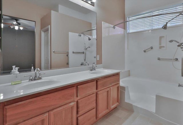 bathroom with ceiling fan, vanity, shower / washtub combination, and tile patterned floors