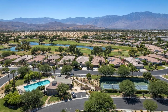 drone / aerial view with a water and mountain view