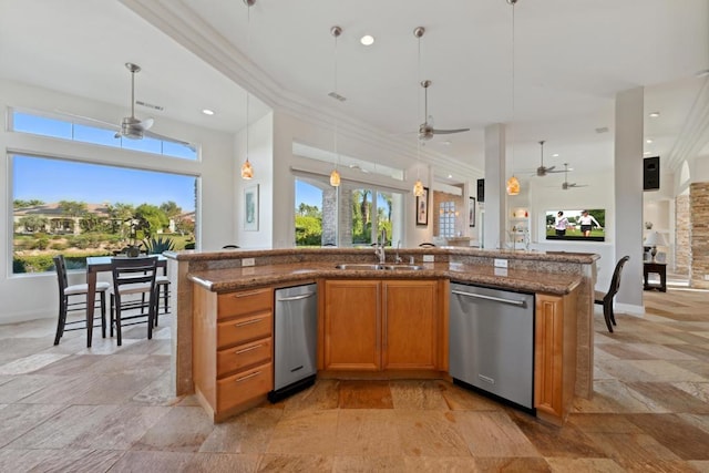 kitchen with sink, hanging light fixtures, dishwasher, and an island with sink