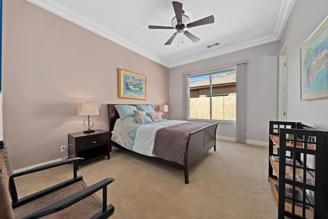 carpeted bedroom with crown molding and ceiling fan