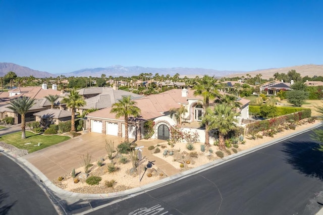 view of front of house with a mountain view and a garage