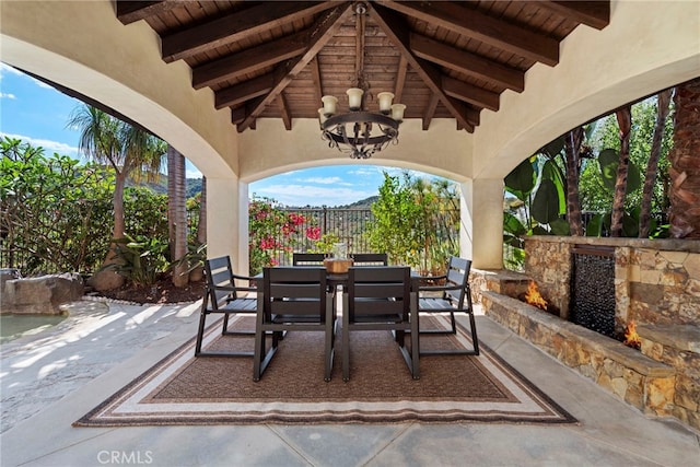 view of patio / terrace featuring an outdoor stone fireplace