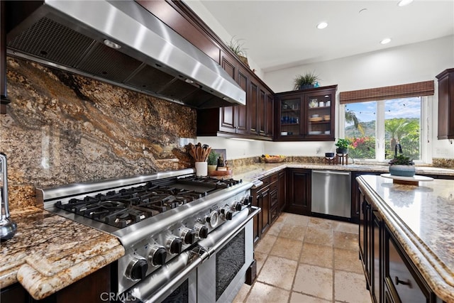 kitchen with ventilation hood, dark brown cabinetry, and stainless steel appliances