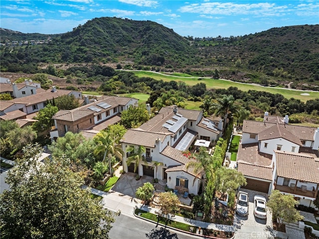 birds eye view of property with a mountain view