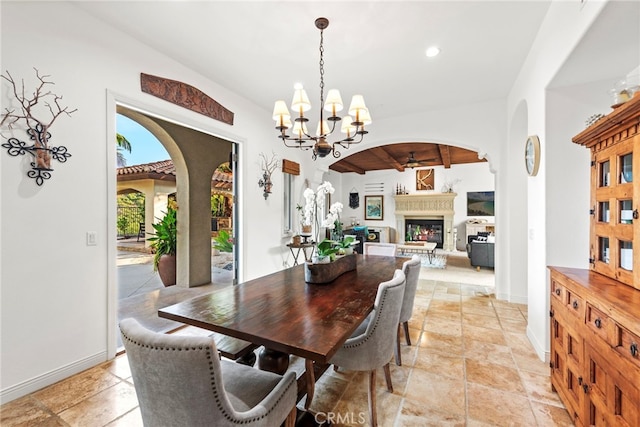 dining space with a chandelier and beamed ceiling