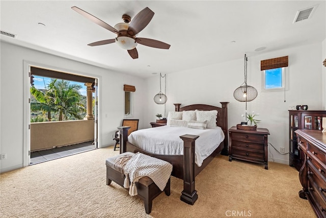 carpeted bedroom featuring ceiling fan and access to exterior