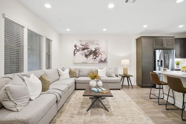 living room with light hardwood / wood-style flooring