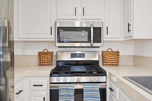 kitchen with white cabinets and stainless steel appliances