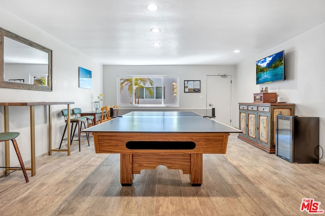 game room with light hardwood / wood-style floors