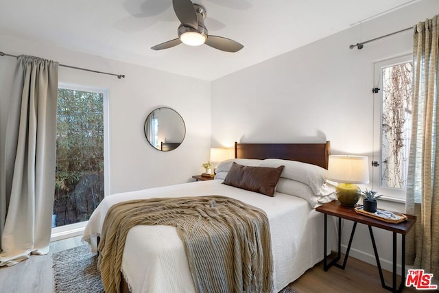 bedroom with hardwood / wood-style floors and ceiling fan