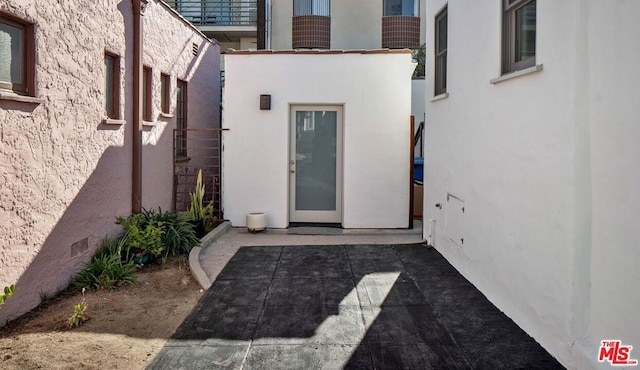 doorway to property featuring a patio area