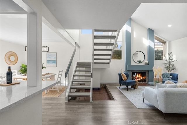 stairway with hardwood / wood-style floors